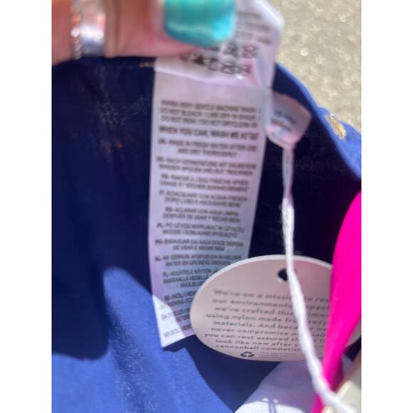 Mini Boden Cross-back Printed Swimsuit in Navy with Gold Foil Confetti Dot - Picture 8 of 9